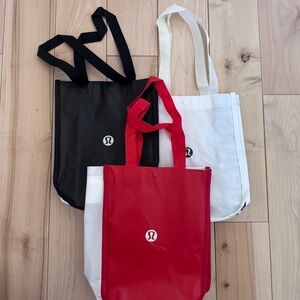 lululemon athletica Black, White, and Red Tote Bags